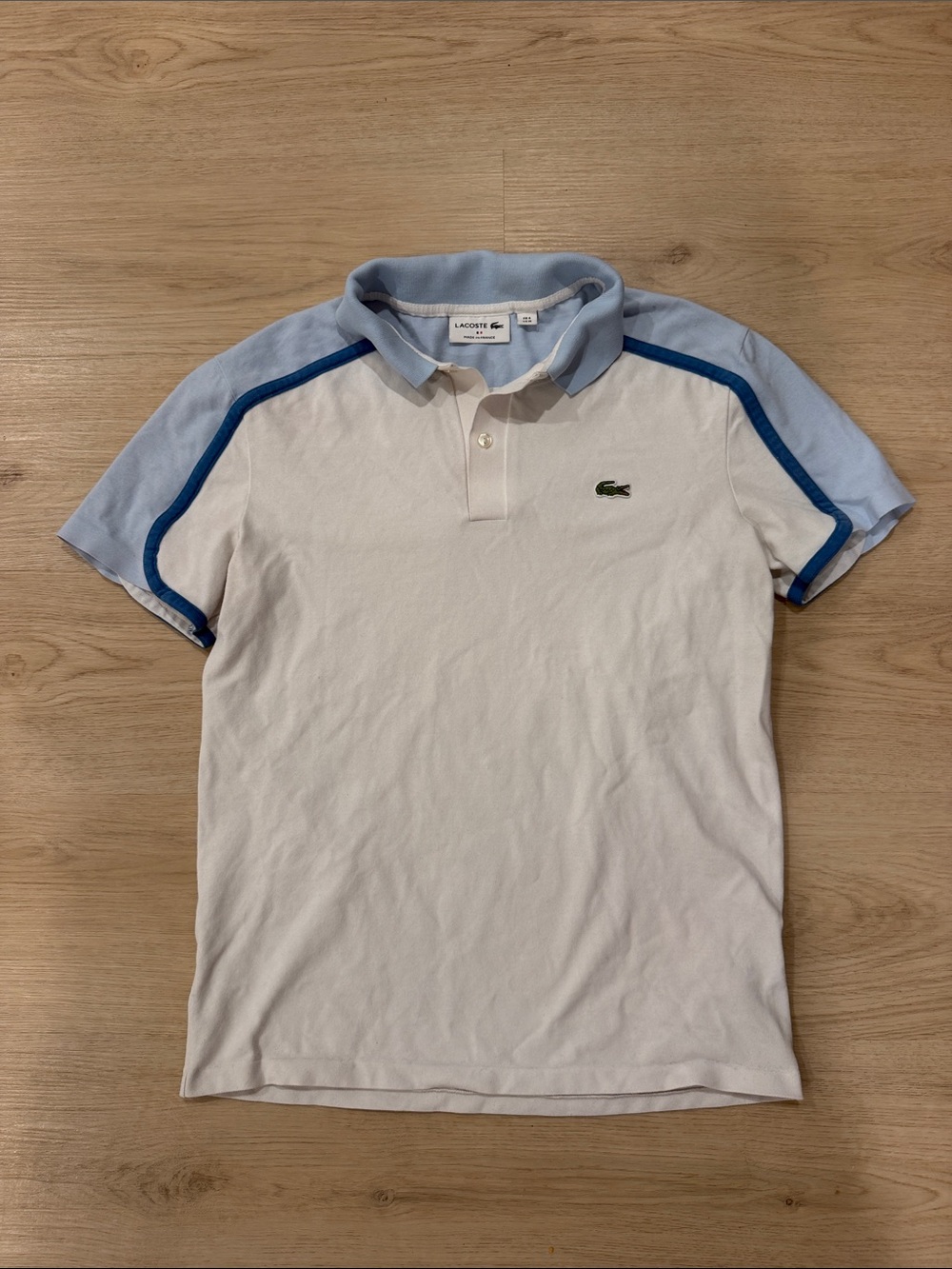 Lacoste medium Men’s White Polo with Light Blue Shoulders and Navy Trim